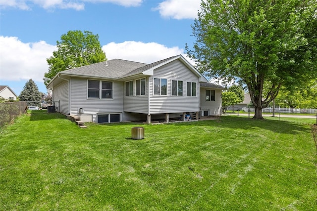 1451 Chamberlain Dr, Iowa City, IA 52240 - back of property with central air condition unit and a shingled roof
