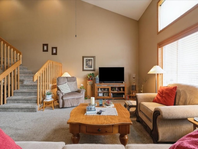 3626 Stoneview Cir SW, Cedar Rapids, IA 52404 - carpeted living room featuring high vaulted ceiling and stairway