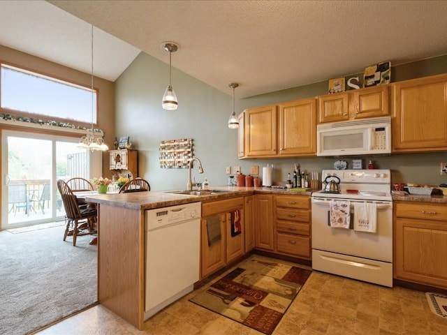 3626 Stoneview Cir SW, Cedar Rapids, IA 52404 - kitchen with white appliances, a sink, a peninsula, decorative light fixtures, and high vaulted ceiling