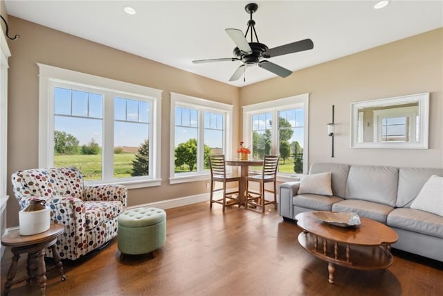 1443 69th St, Keystone, IA 52249 - living room with wood finished floors, baseboards, recessed lighting, and ceiling fan
