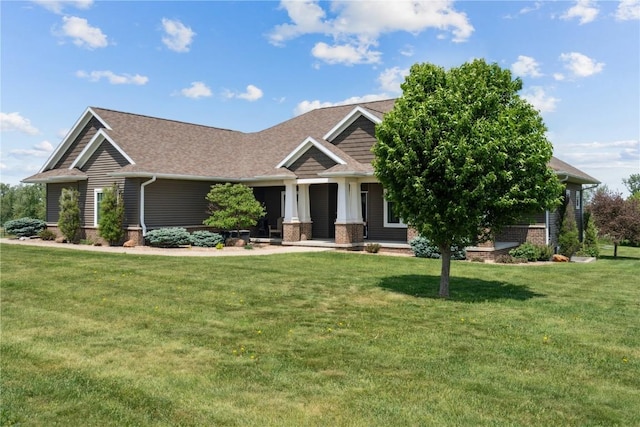 1443 69th St, Keystone, IA 52249 - craftsman-style home featuring a front yard, roof with shingles, and brick siding