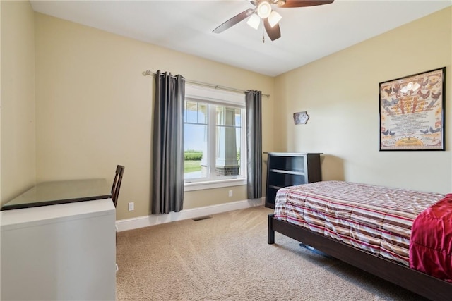 1443 69th St, Keystone, IA 52249 - carpeted bedroom with baseboards and ceiling fan