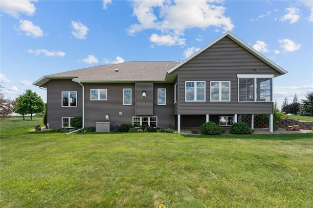 1443 69th St, Keystone, IA 52249 - back of house with a yard and central AC