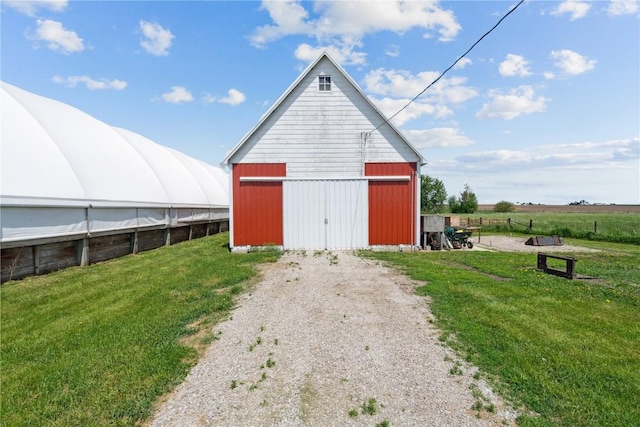 1443 69th St, Keystone, IA 52249 - view of pole building featuring a lawn and driveway