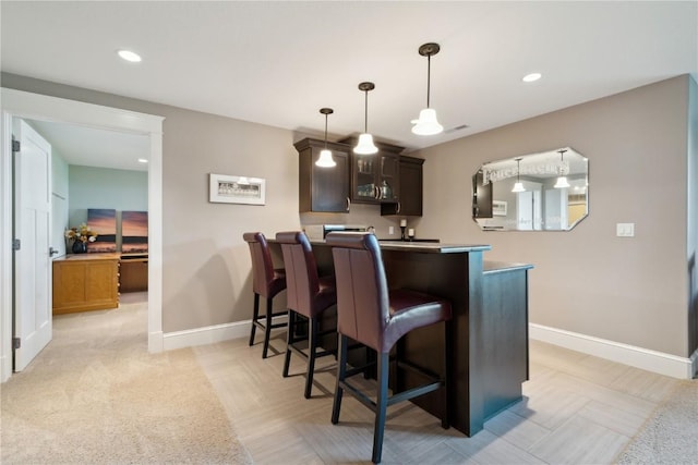 1443 69th St, Keystone, IA 52249 - bar featuring baseboards, recessed lighting, and hanging light fixtures