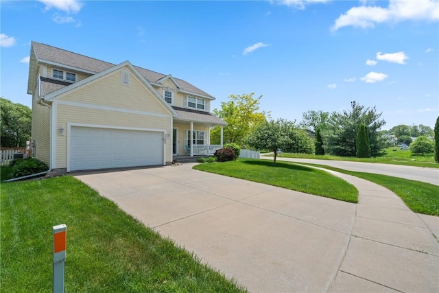 3205 Lennon Ln, Marion, IA 52302 - view of front facade with a front lawn, covered porch, concrete driveway, and a garage