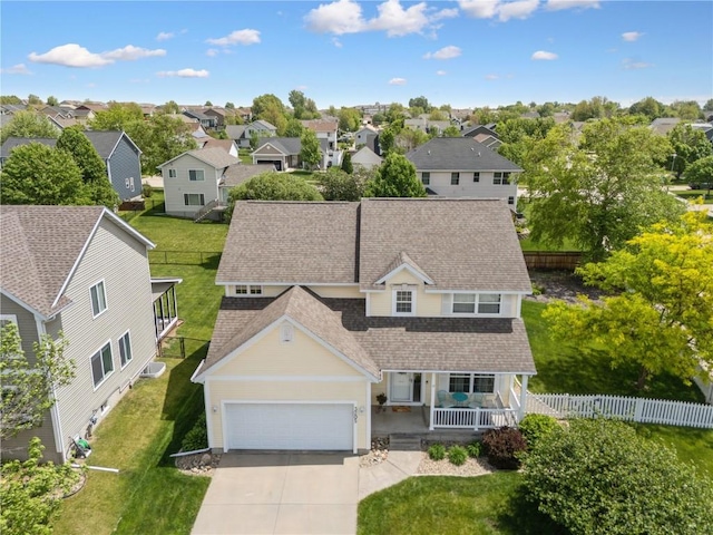 3205 Lennon Ln, Marion, IA 52302 - view of front of house with covered porch, roof with shingles, a garage, driveway, and a residential view