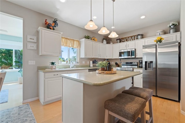3205 Lennon Ln, Marion, IA 52302 - kitchen with appliances with stainless steel finishes, a sink, healthy amount of natural light, white cabinets, and recessed lighting