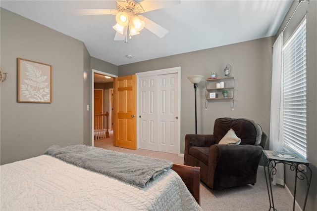 3205 Lennon Ln, Marion, IA 52302 - bedroom featuring light colored carpet, a closet, ceiling fan, and baseboards