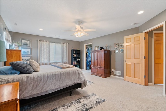 3205 Lennon Ln, Marion, IA 52302 - bedroom featuring light carpet, a spacious closet, baseboards, ceiling fan, and recessed lighting