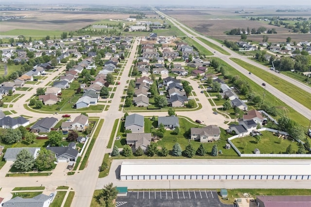 aerial view of property and surrounding area with nearby suburban area