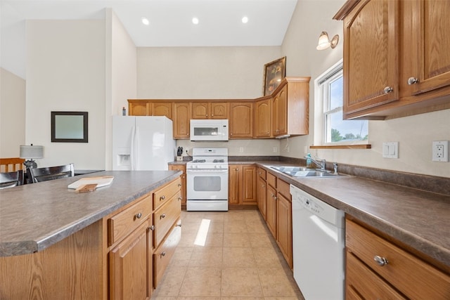 kitchen featuring white appliances, a sink, dark countertops, light tile patterned floors, and brown cabinets