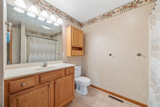 bathroom with baseboards, toilet, vanity, and a shower with curtain