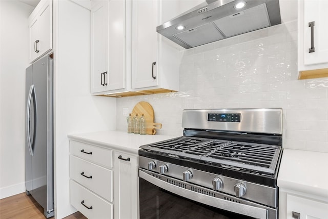 424 15th Ave SW, Mount Vernon, IA 52314 - kitchen featuring exhaust hood, appliances with stainless steel finishes, light countertops, and white cabinetry