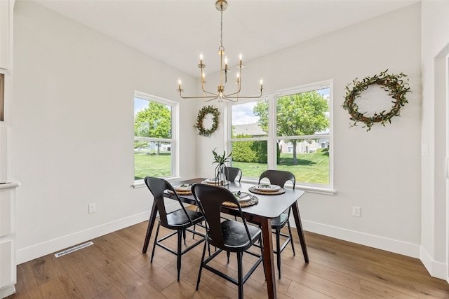 424 15th Ave SW, Mount Vernon, IA 52314 - dining room with a chandelier, wood finished floors, and baseboards