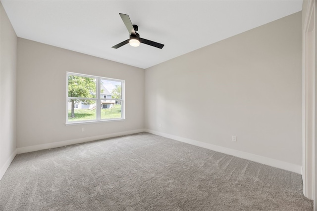 424 15th Ave SW, Mount Vernon, IA 52314 - empty room with carpet flooring, baseboards, and ceiling fan