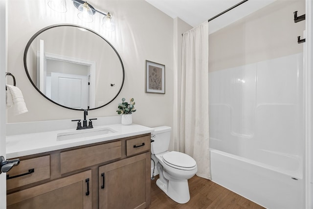 424 15th Ave SW, Mount Vernon, IA 52314 - bathroom featuring toilet, wood finished floors, vanity, and shower / bathtub combination with curtain
