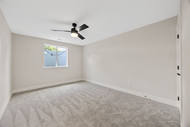 424 15th Ave SW, Mount Vernon, IA 52314 - carpeted spare room with baseboards and a ceiling fan