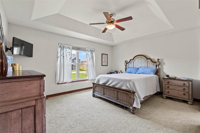 395 Carlyle Dr, North Liberty, IA 52317 - bedroom with a raised ceiling, light carpet, baseboards, and ceiling fan