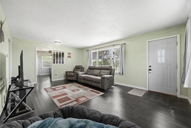 3353 Midway Rd, Marion, IA 52302 - living room featuring a textured ceiling, hardwood / wood-style floors, baseboards, and a ceiling fan