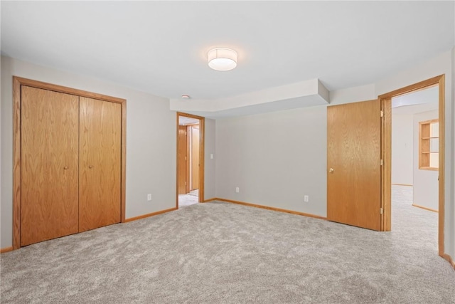942 Evergreen Ct, Iowa City, IA 52245 - unfurnished bedroom with carpet floors, a closet, and baseboards