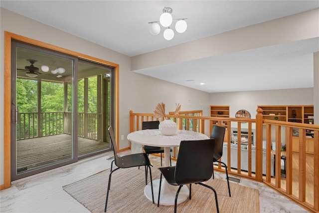 942 Evergreen Ct, Iowa City, IA 52245 - dining space with marble finish floors and a ceiling fan