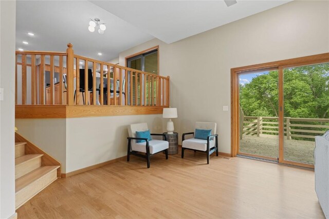 942 Evergreen Ct, Iowa City, IA 52245 - living area featuring stairs, wood finished floors, baseboards, and recessed lighting
