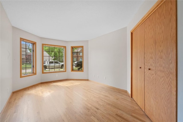 942 Evergreen Ct, Iowa City, IA 52245 - spare room with light wood finished floors and baseboards