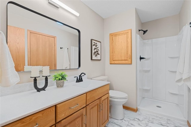 942 Evergreen Ct, Iowa City, IA 52245 - full bath with marble finish floors, a shower stall, toilet, and vanity