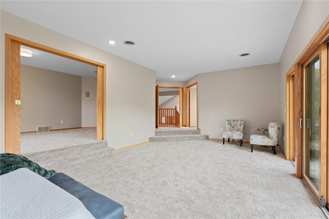 942 Evergreen Ct, Iowa City, IA 52245 - sitting room with carpet, baseboards, recessed lighting, and stairway