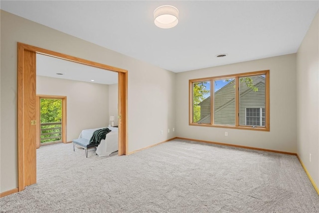 942 Evergreen Ct, Iowa City, IA 52245 - spare room with carpet floors, healthy amount of natural light, and baseboards