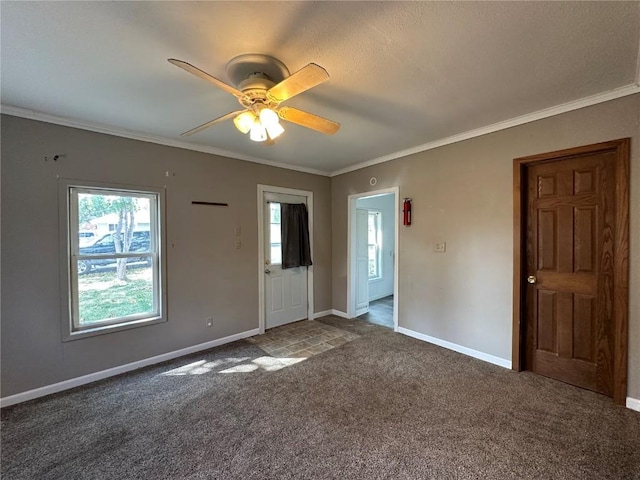 1338 22nd Ave SW, Cedar Rapids, IA 52404 - carpeted spare room with ornamental molding, baseboards, a ceiling fan, and plenty of natural light