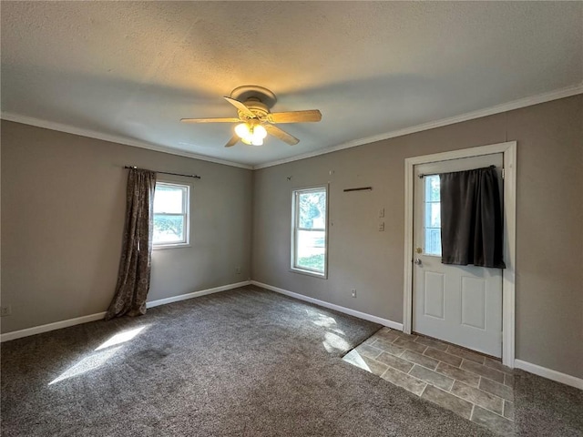 1338 22nd Ave SW, Cedar Rapids, IA 52404 - empty room featuring carpet flooring, baseboards, ceiling fan, ornamental molding, and a textured ceiling