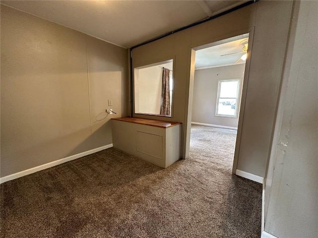 1338 22nd Ave SW, Cedar Rapids, IA 52404 - spare room featuring carpet floors, baseboards, and ornamental molding