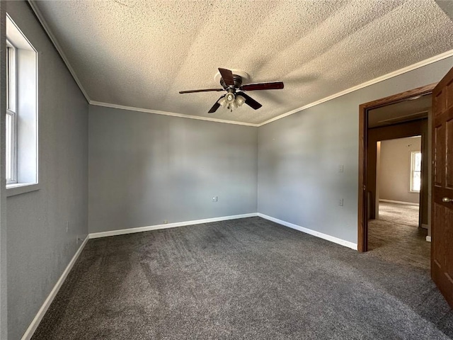 1338 22nd Ave SW, Cedar Rapids, IA 52404 - unfurnished room with a textured ceiling, a ceiling fan, dark carpet, ornamental molding, and baseboards