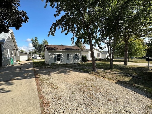 1338 22nd Ave SW, Cedar Rapids, IA 52404 - view of front of home with a detached garage and an outbuilding