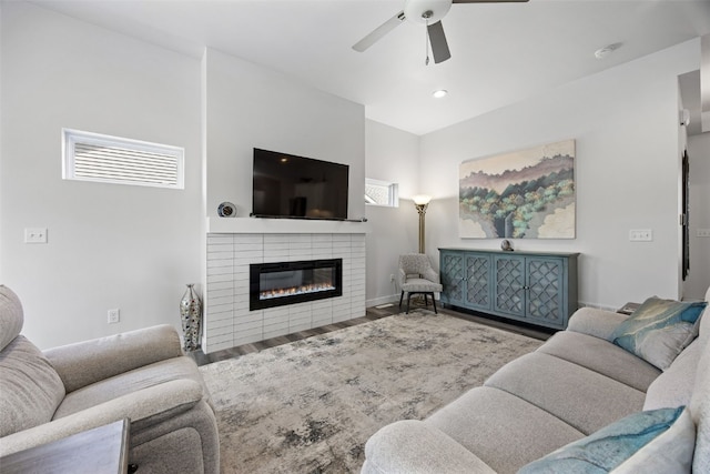 8 Pinnacle Ln, Tiffin, IA 52340 - living room featuring a ceiling fan, a glass covered fireplace, wood finished floors, baseboards, and recessed lighting