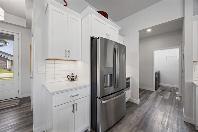 8 Pinnacle Ln, Tiffin, IA 52340 - kitchen with stainless steel fridge, light countertops, wood finished floors, white cabinetry, and recessed lighting