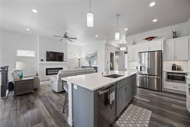 8 Pinnacle Ln, Tiffin, IA 52340 - kitchen featuring stainless steel appliances, a sink, light countertops, a ceiling fan, and recessed lighting