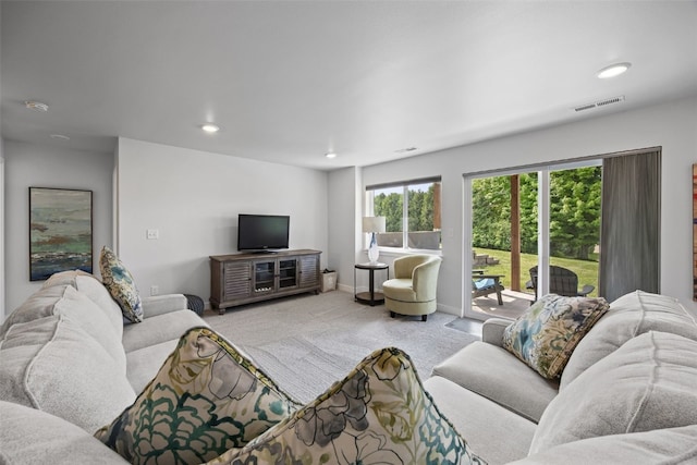 8 Pinnacle Ln, Tiffin, IA 52340 - living room featuring carpet flooring, plenty of natural light, baseboards, and recessed lighting