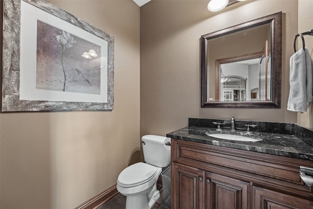 4355 Par Cir, Marion, IA 52302 - half bathroom featuring vanity, toilet, and baseboards
