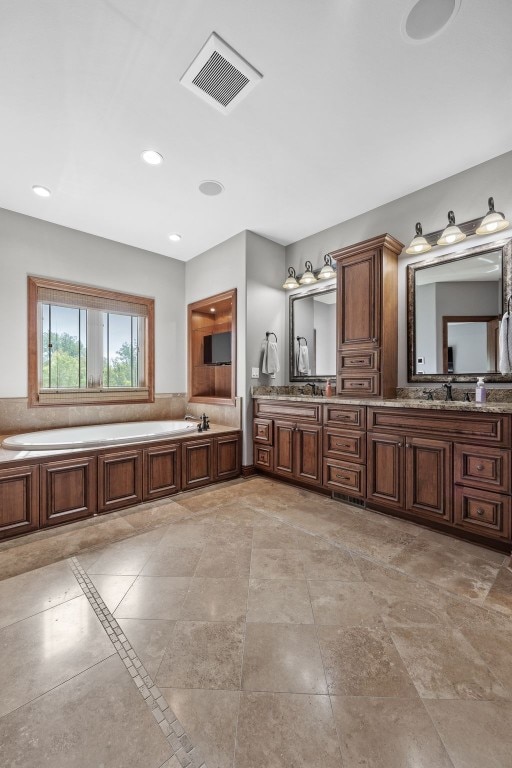 4355 Par Cir, Marion, IA 52302 - bathroom with a bath, double vanity, and recessed lighting