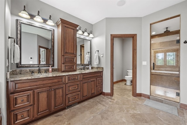 4355 Par Cir, Marion, IA 52302 - bathroom with toilet, a shower stall, double vanity, and baseboards