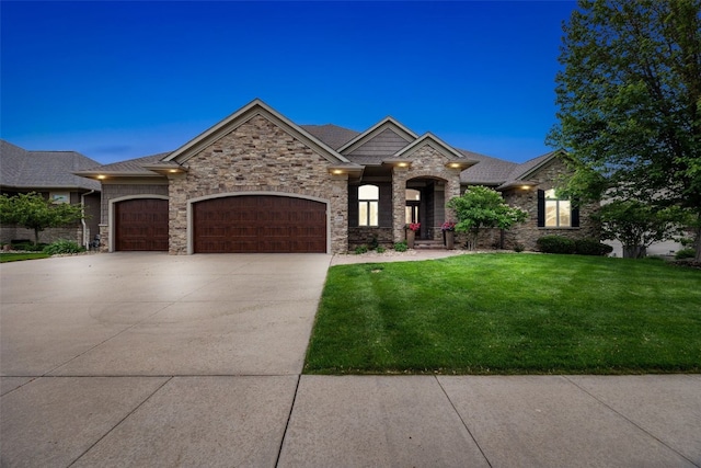 4355 Par Cir, Marion, IA 52302 - view of front of property with a front yard, a garage, driveway, stone siding, and a shingled roof