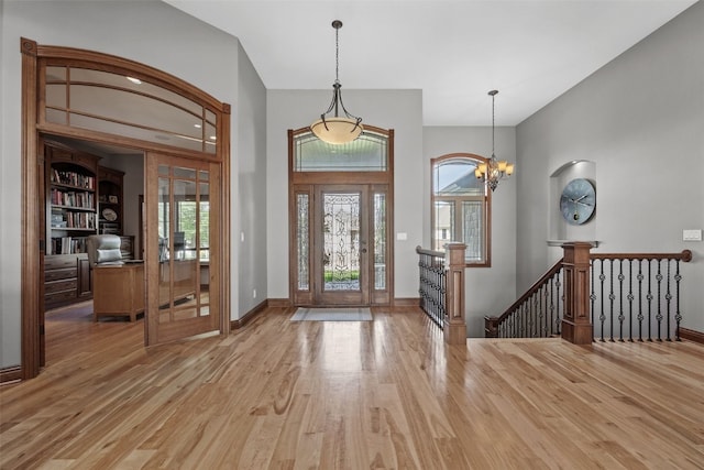 4355 Par Cir, Marion, IA 52302 - foyer entrance with wood finished floors, a chandelier, and baseboards