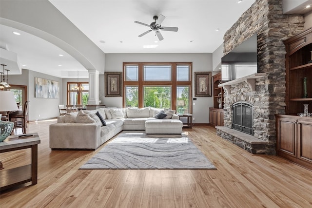 4355 Par Cir, Marion, IA 52302 - living area featuring a ceiling fan, decorative columns, arched walkways, light wood finished floors, and recessed lighting