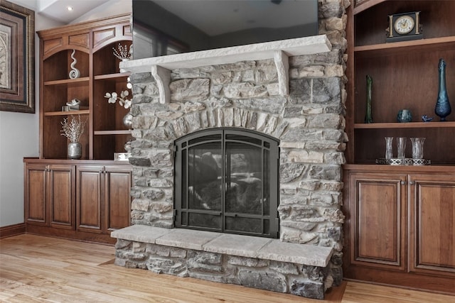 4355 Par Cir, Marion, IA 52302 - living room with light wood-type flooring, a stone fireplace, and baseboards