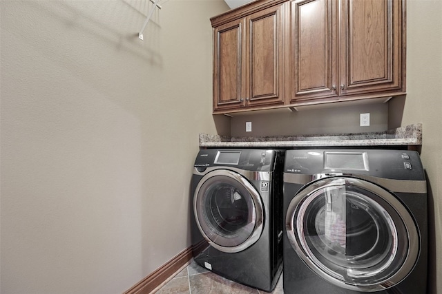 4355 Par Cir, Marion, IA 52302 - washroom featuring separate washer and dryer, cabinet space, baseboards, and tile patterned flooring