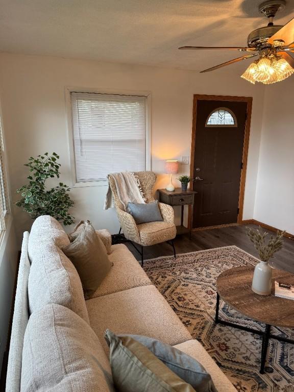 3105 Wilson Ave SW, Cedar Rapids, IA 52404 - living room featuring wood finished floors, ceiling fan, and baseboards
