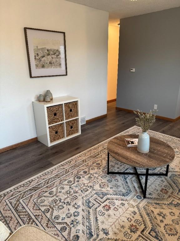 3105 Wilson Ave SW, Cedar Rapids, IA 52404 - living area with dark wood finished floors and baseboards